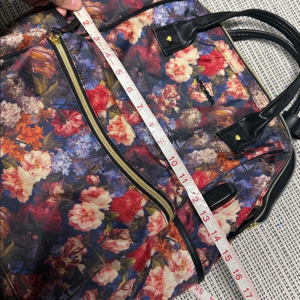 KROSER laptop backpack featuring a dark floral pattern